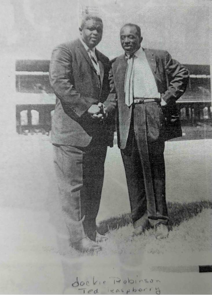 Jackie Robinson with local base-ball impresario Ted Rasberry shaking hands, 1960